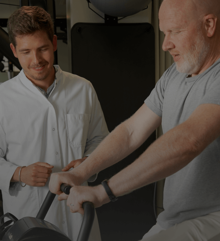 Medical professional assisting an older man during a clinical study session